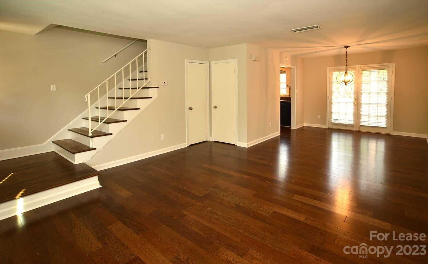 a view of an entryway with wooden floor