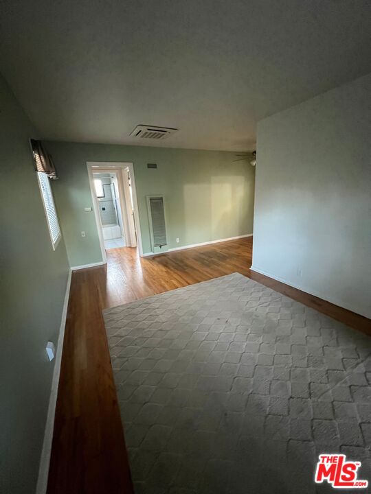 2599 Morningside Street, Unit D Pasadena, CA 91107 - Photo 4 of 13 wooden floor in an empty room with a window