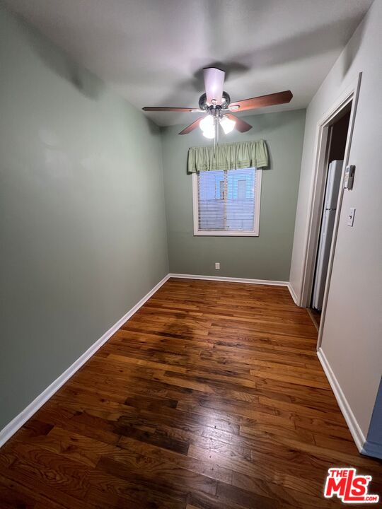 2599 Morningside Street, Unit D Pasadena, CA 91107 - Photo 5 of 13 an empty room with wooden floor fan and window