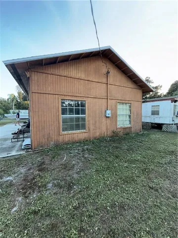 a house view with a backyard space