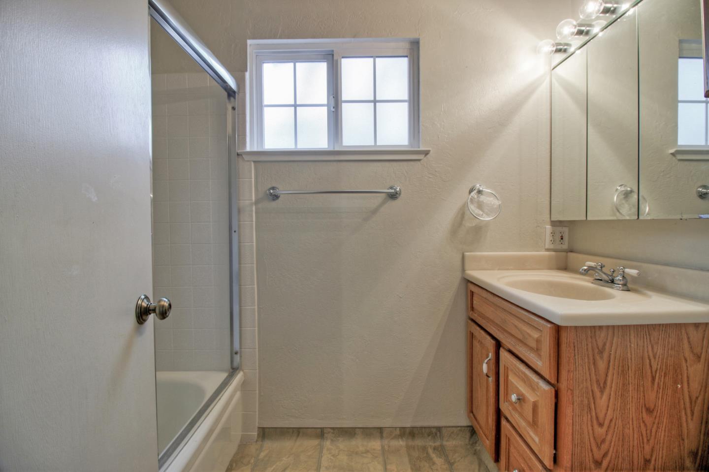640 Harriet Avenue Campbell, CA 95008 - Photo 11 of 14 a bathroom with a sink a vanity and a mirror