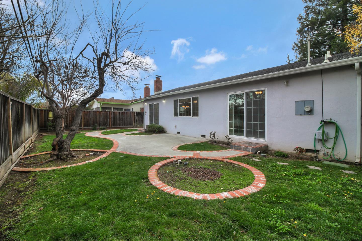 640 Harriet Avenue Campbell, CA 95008 - Photo 13 of 14 a view of a house with backyard and sitting area