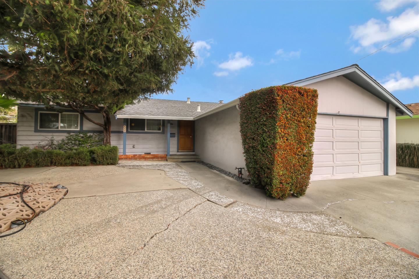 640 Harriet Avenue Campbell, CA 95008 - Photo 2 of 14 a view of a house with a yard and garage