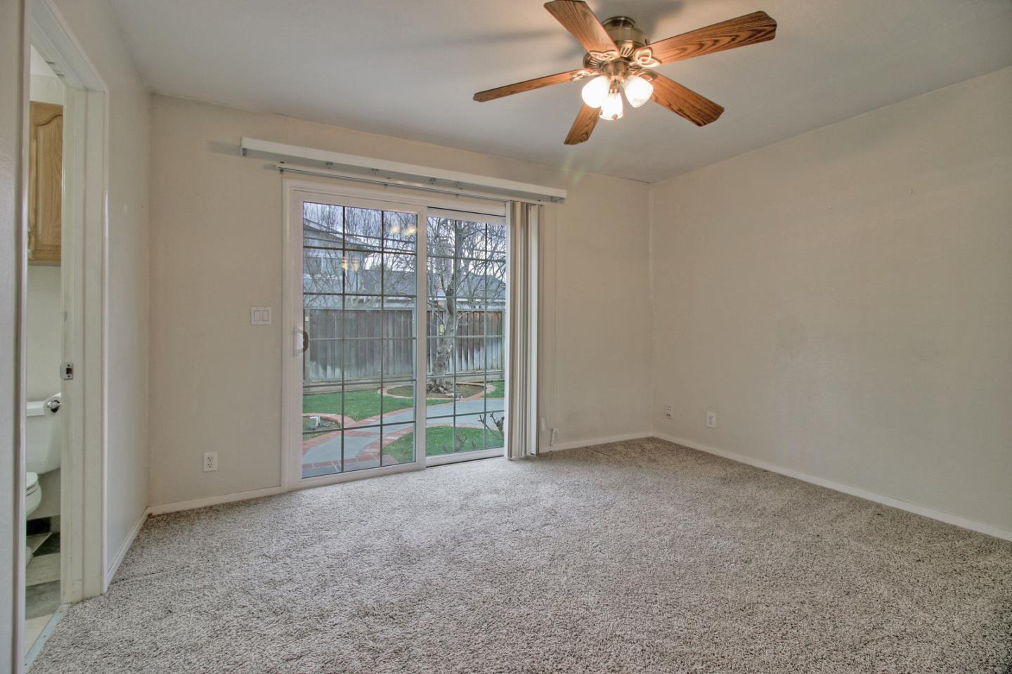 640 Harriet Avenue Campbell, CA 95008 - Photo 6 of 14 a view of room with ceiling fan and window