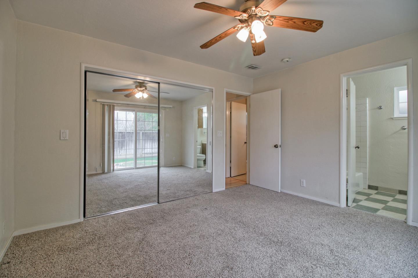 640 Harriet Avenue Campbell, CA 95008 - Photo 7 of 14 a view of an empty room with a fan