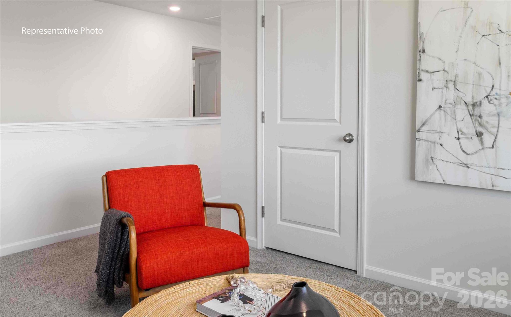 7592 Bainbridge Road Sherrills Ford, NC 28673 - Photo 24 of 28 a bedroom with a bed and a chair