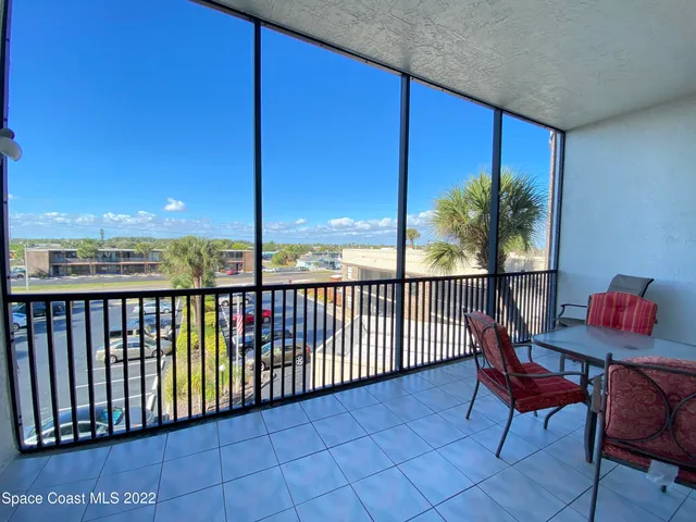 a view of a chairs and table in patio