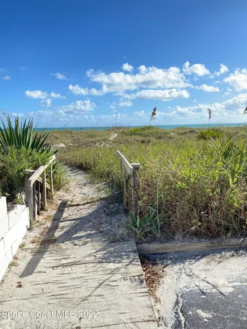 a view of a swimming pool with seating area