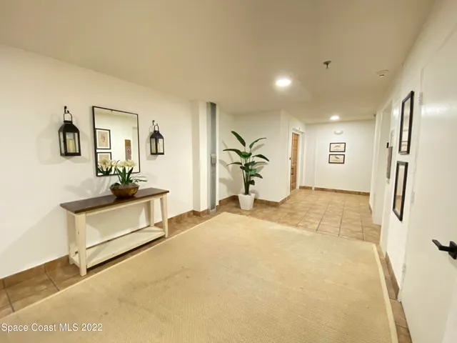 a spacious bathroom with a double vanity sink a mirror and a bathtub