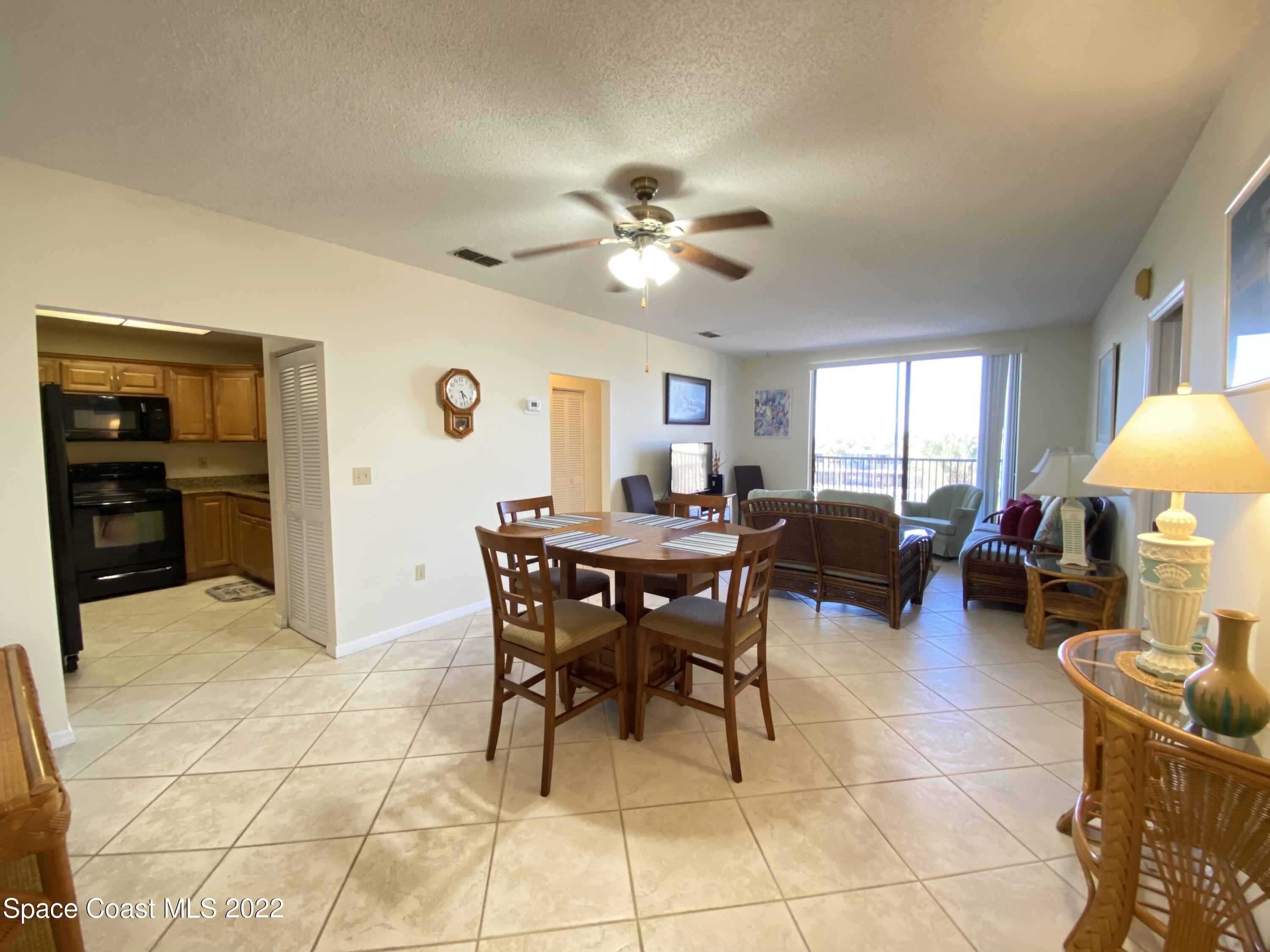 333 North Atlantic Avenue, Unit 305 Cocoa Beach, FL 32931 - Photo 6 of 21 a view of a livingroom with furniture and a window