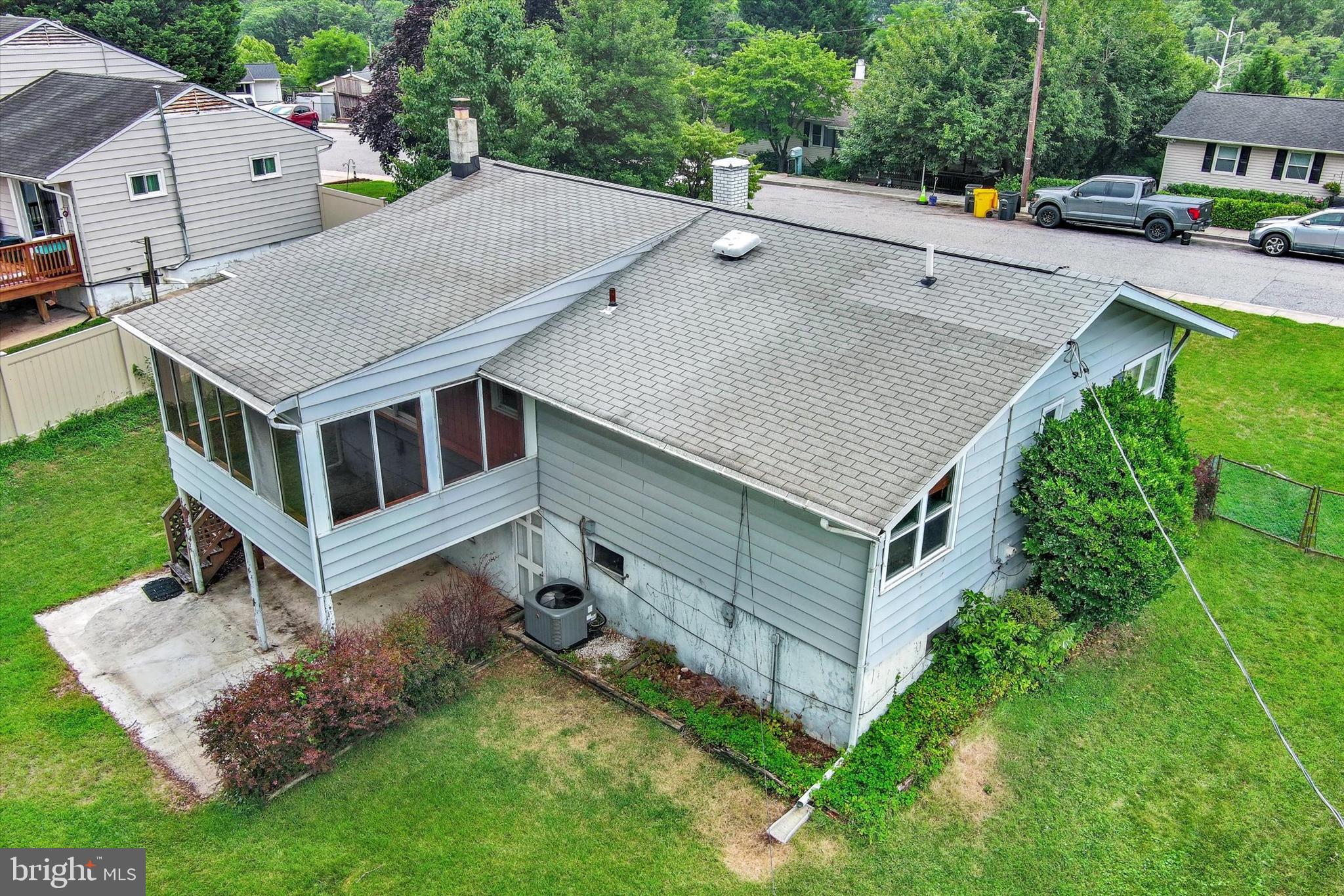 306 Regency Circle Linthicum Heights, MD 21090 - Photo 49 of 73 Rear aerial with patio and lawn.