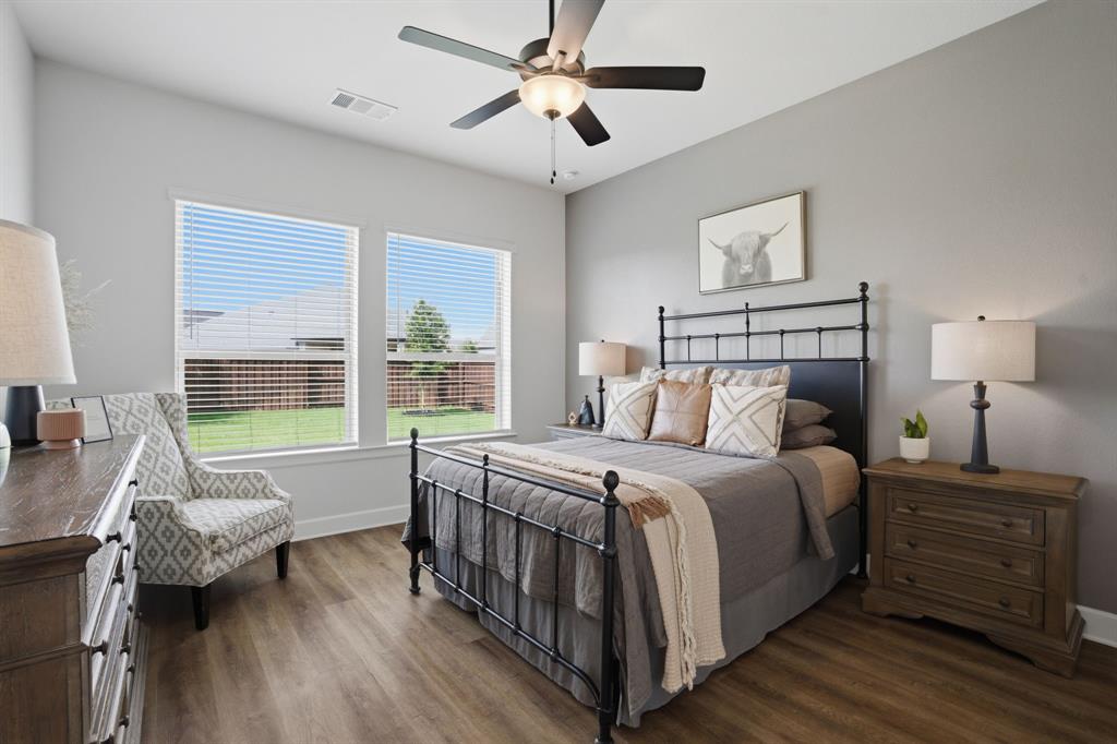 1632 Cotton Road Van Alstyne, TX 75495 - Photo 17 of 40 a bed room with a bed and a chandelier
