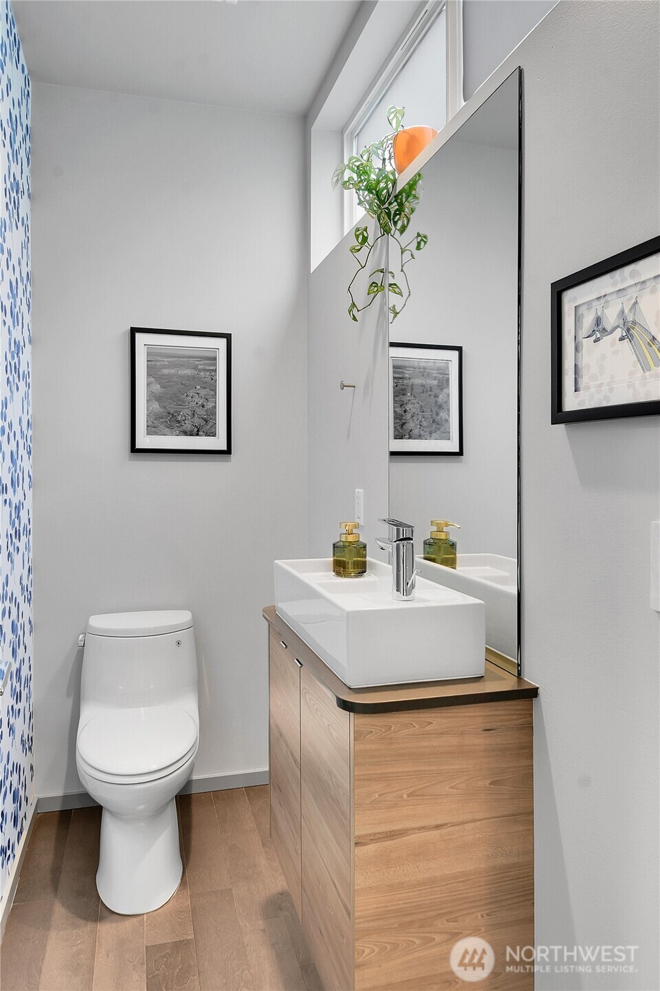 5009 Renton Avenue South, Unit C Seattle, WA 98118 - Photo 12 of 26 a bathroom with a toilet a sink and mirror
