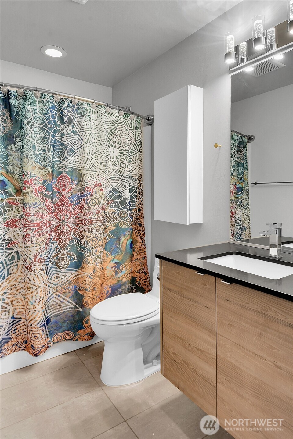 5009 Renton Avenue South, Unit C Seattle, WA 98118 - Photo 15 of 26 a bathroom with a sink toilet and shower