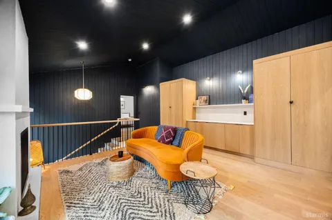 a bedroom with a bed and a couch