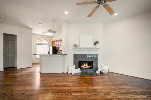 a living room with furniture fireplace and window
