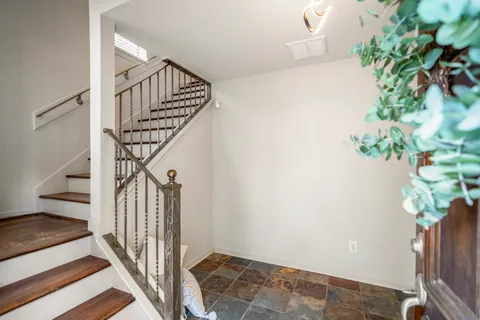 a view of entryway with wooden floor