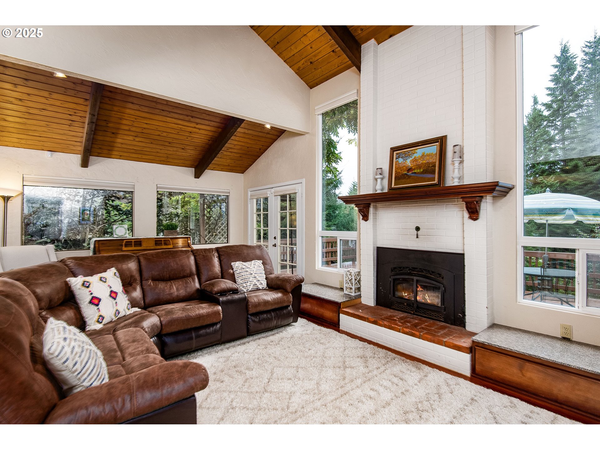 5001 Ford Way Florence, OR 97439 - Photo 11 of 48 a living room with furniture a flat screen tv and a fireplace