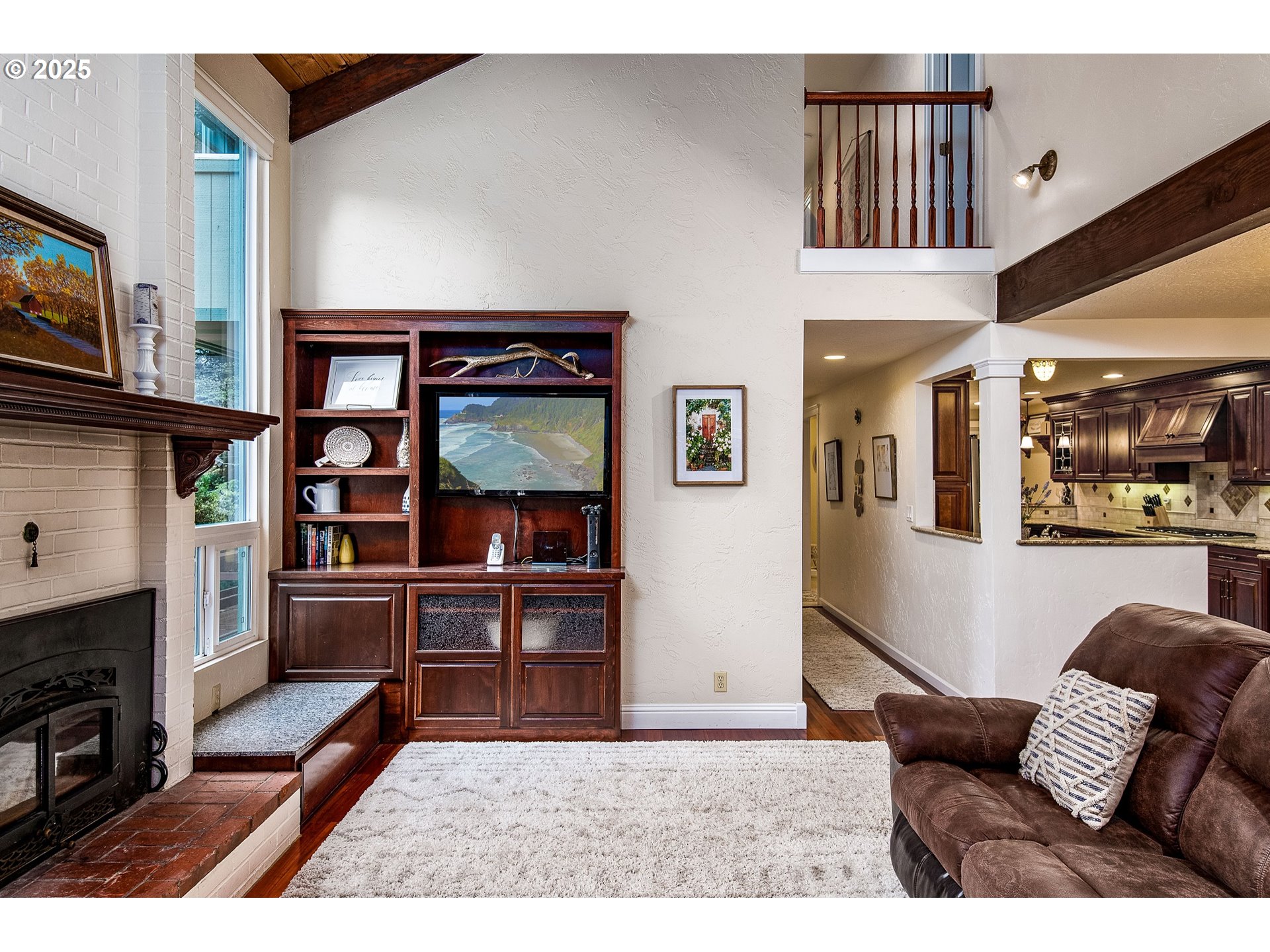 5001 Ford Way Florence, OR 97439 - Photo 13 of 48 a living room with furniture a rug and kitchen view