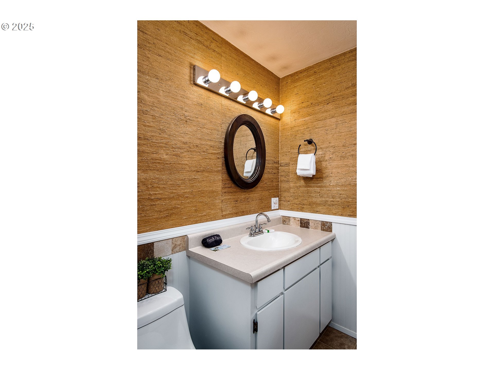 5001 Ford Way Florence, OR 97439 - Photo 17 of 48 a bathroom with a sink vanity and a mirror