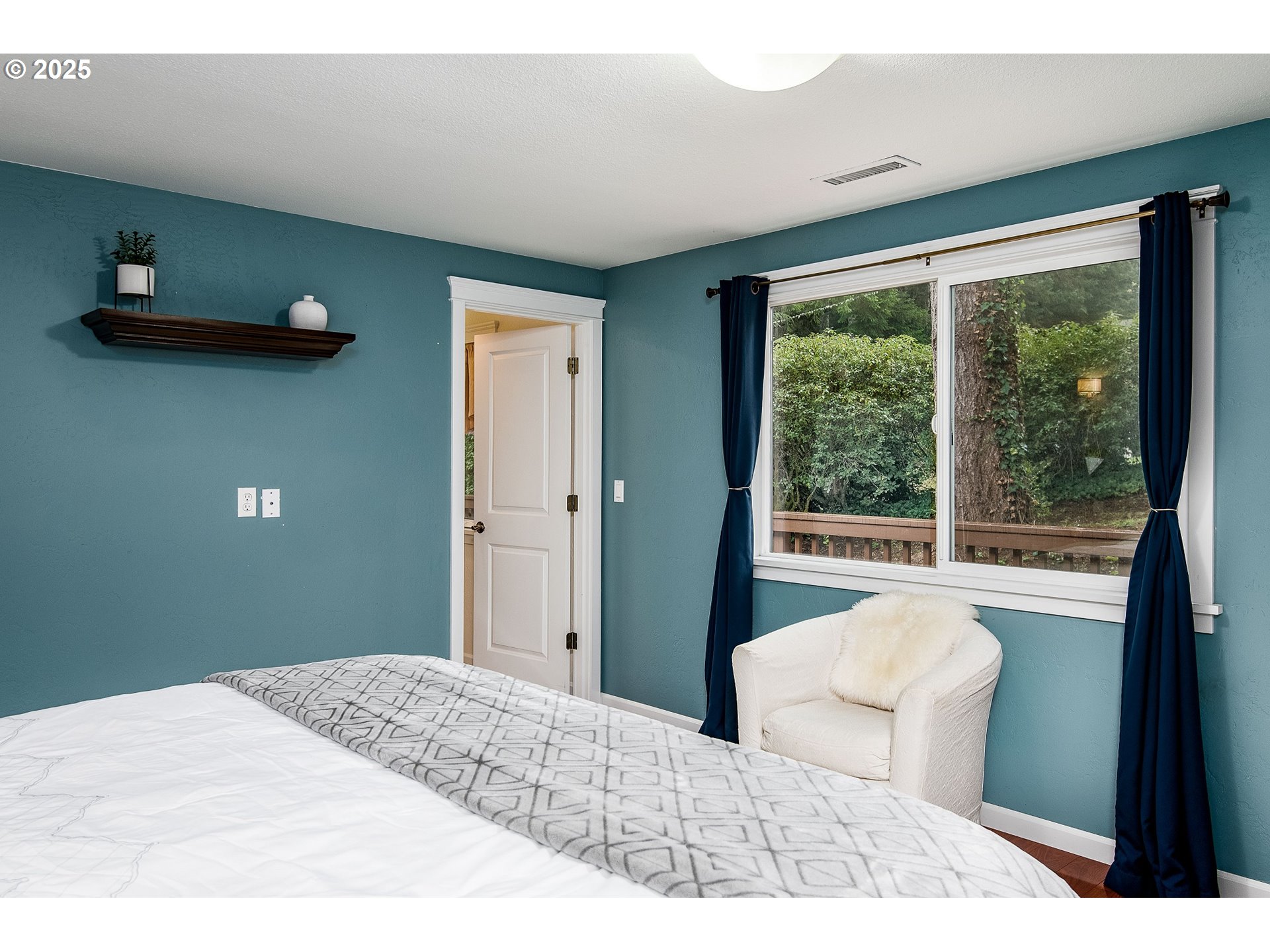 5001 Ford Way Florence, OR 97439 - Photo 21 of 48 a bedroom with a bed and a large window