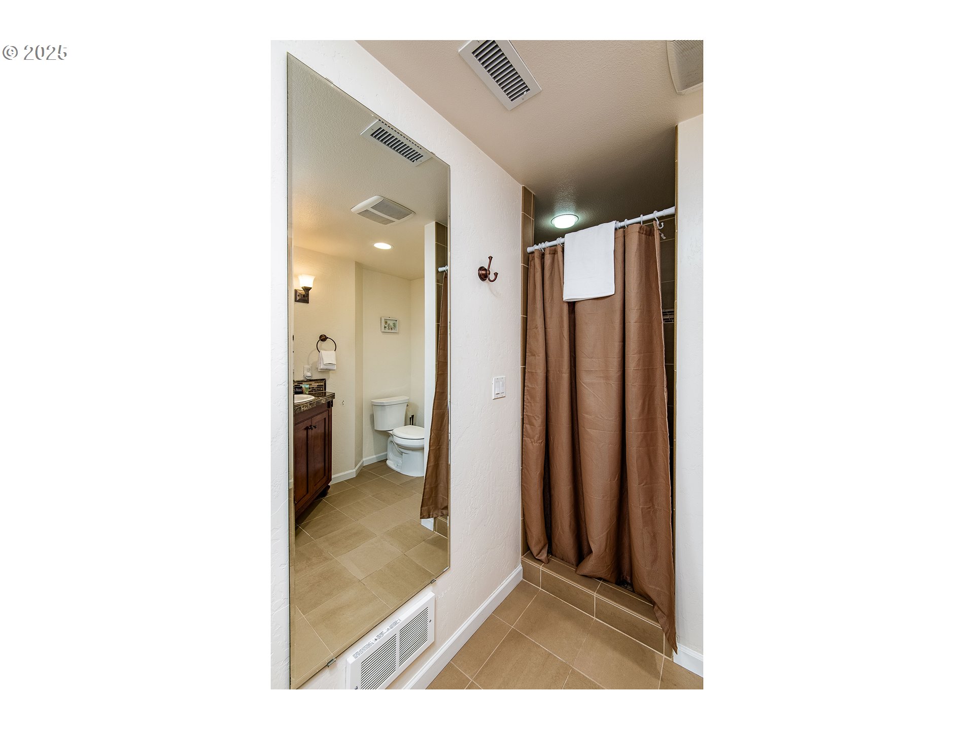 5001 Ford Way Florence, OR 97439 - Photo 26 of 48 a view of a bathroom with a shower and a mirror