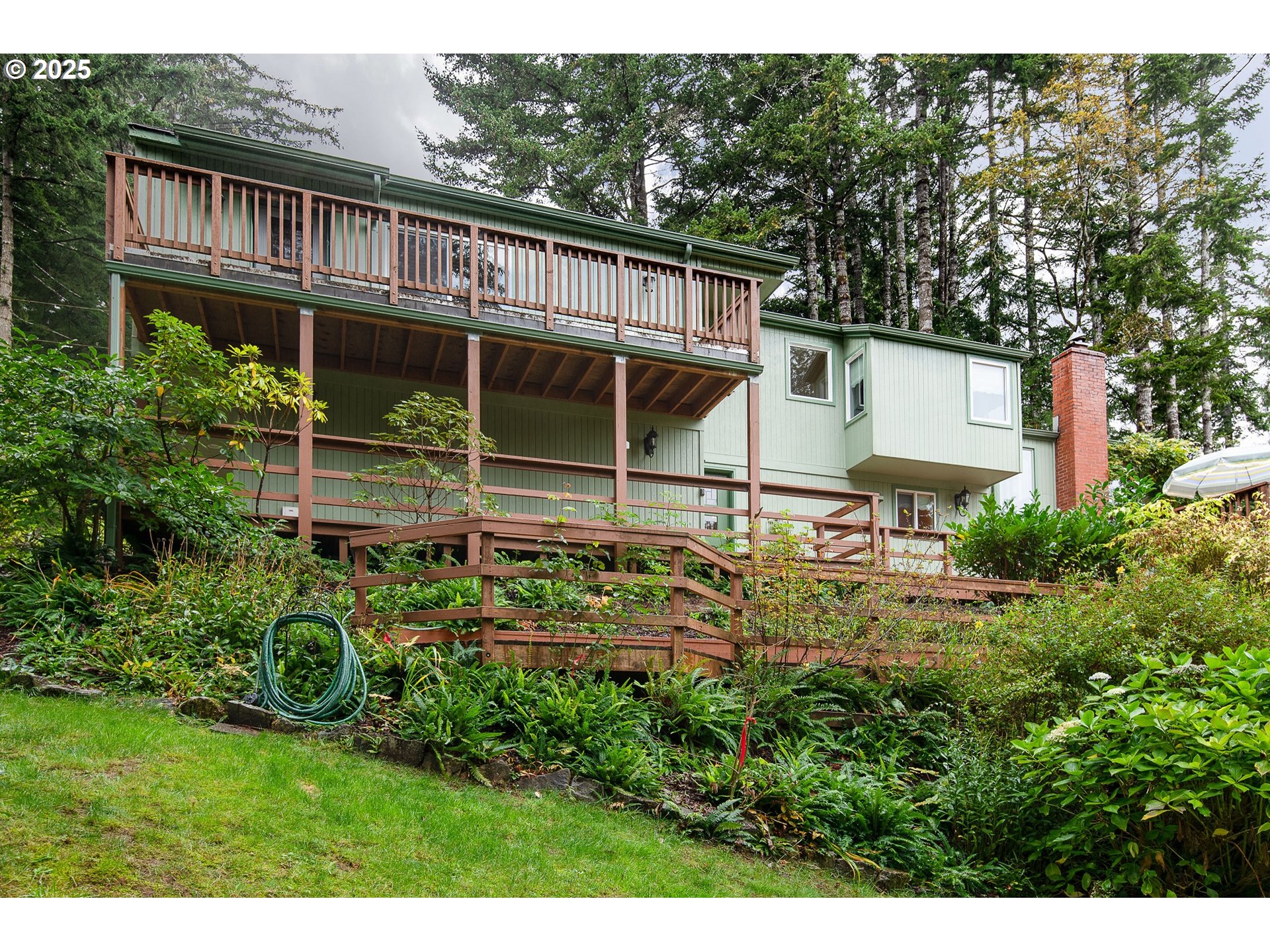 5001 Ford Way Florence, OR 97439 - Photo 3 of 48 a view of a house with a yard