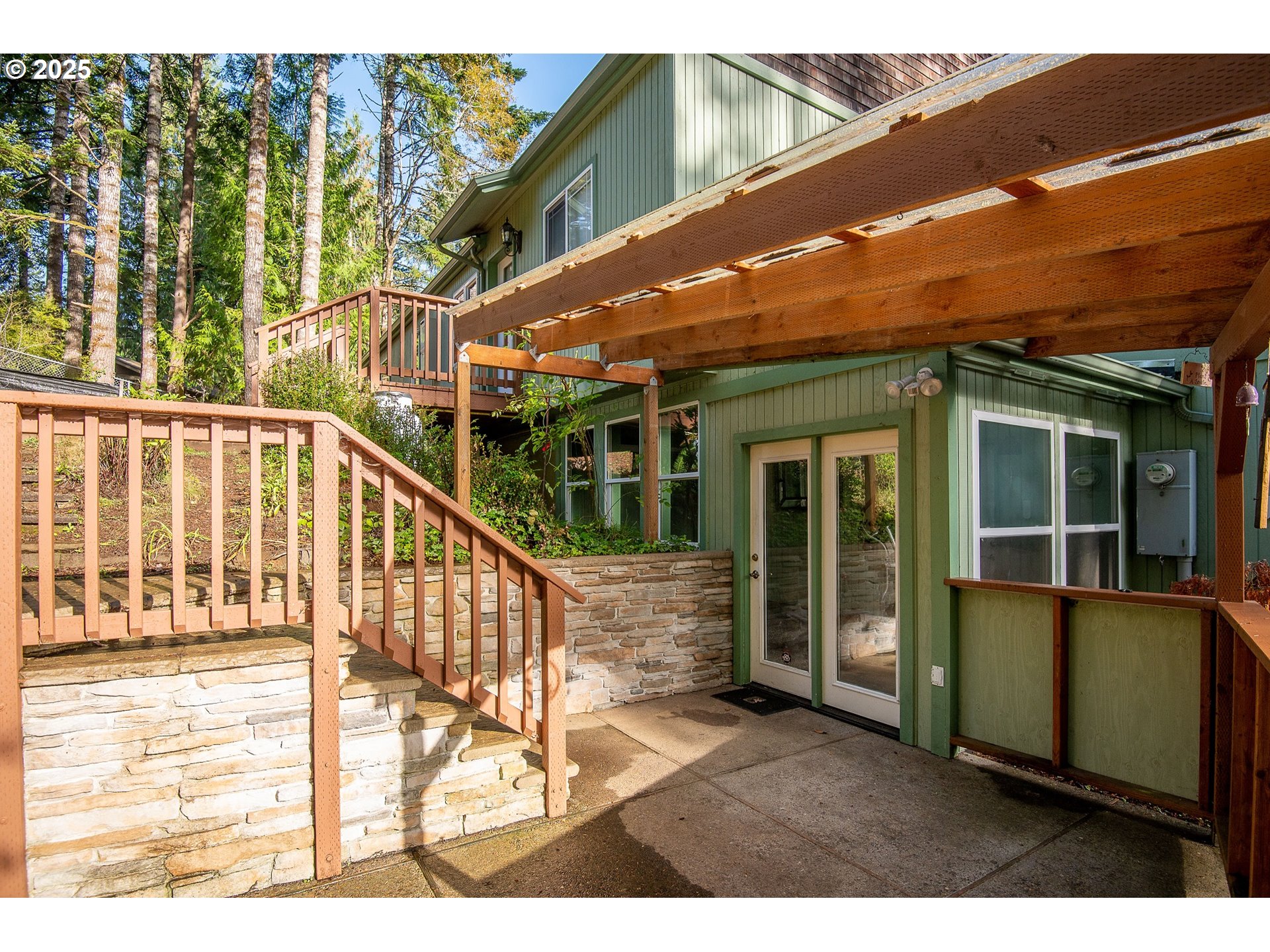 5001 Ford Way Florence, OR 97439 - Photo 38 of 48 a view of a house with backyard and porch