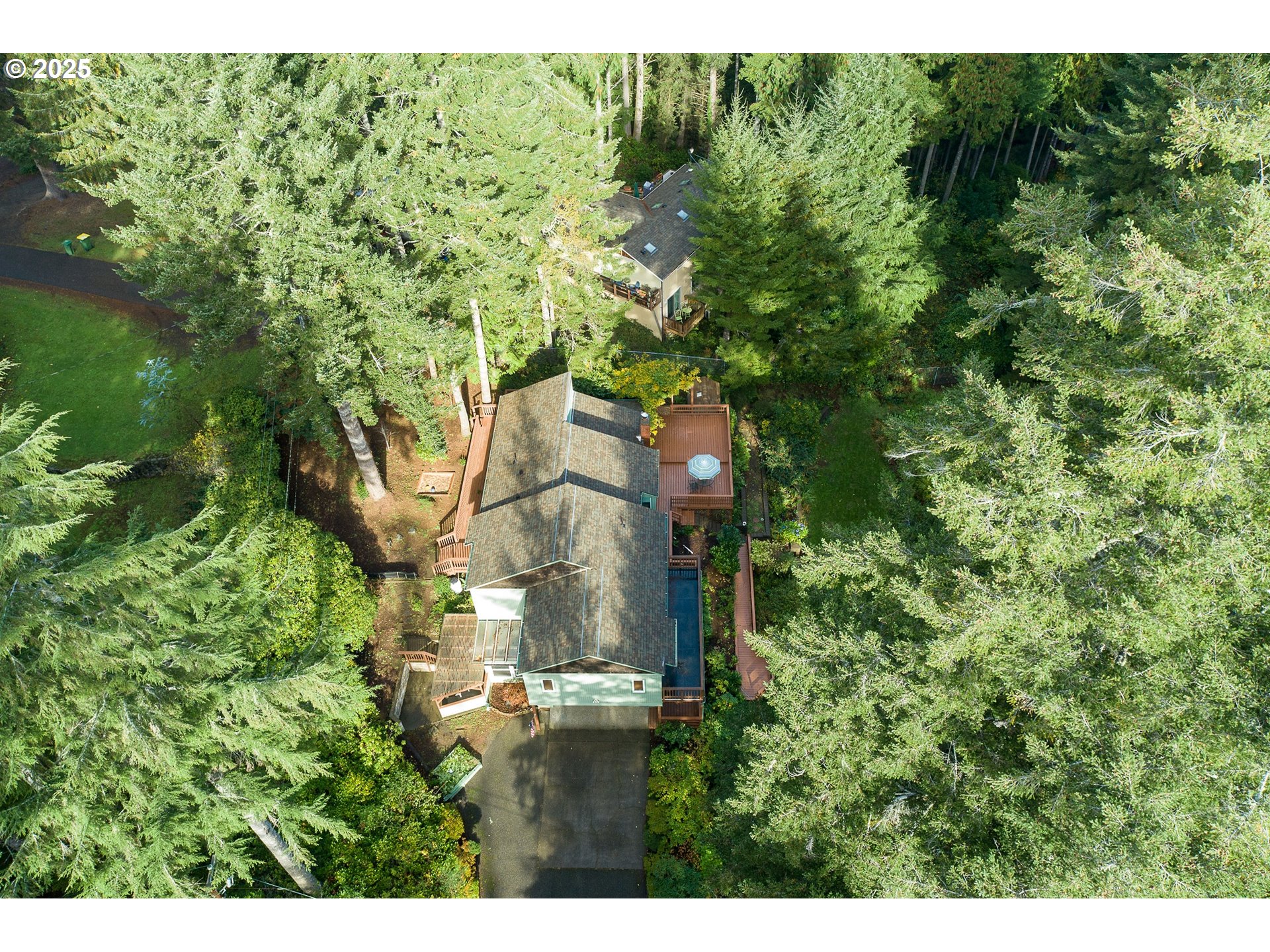 5001 Ford Way Florence, OR 97439 - Photo 45 of 48 a backyard of a house with lots of green space