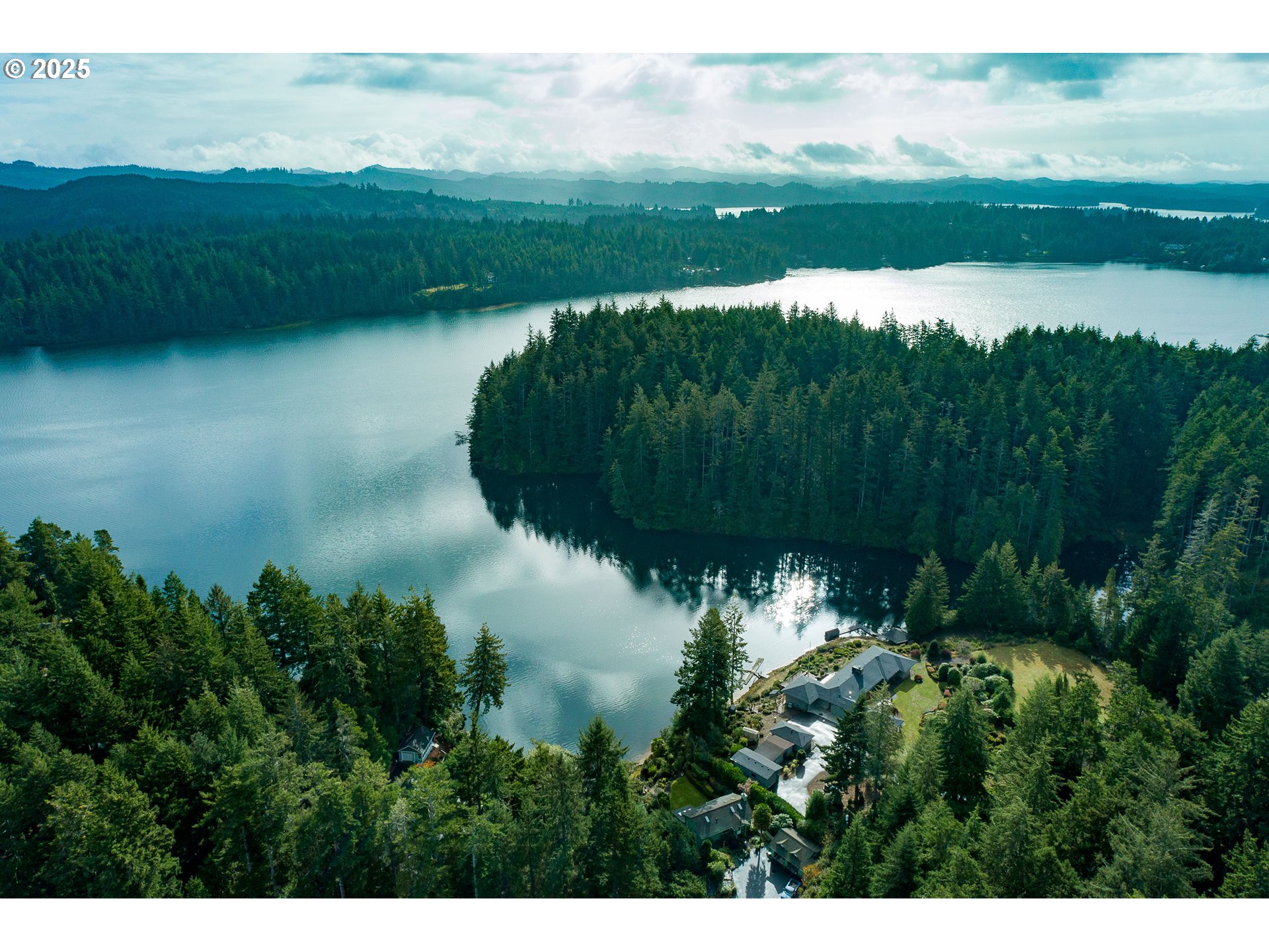 5001 Ford Way Florence, OR 97439 - Photo 48 of 48 a view of a lake with a yard