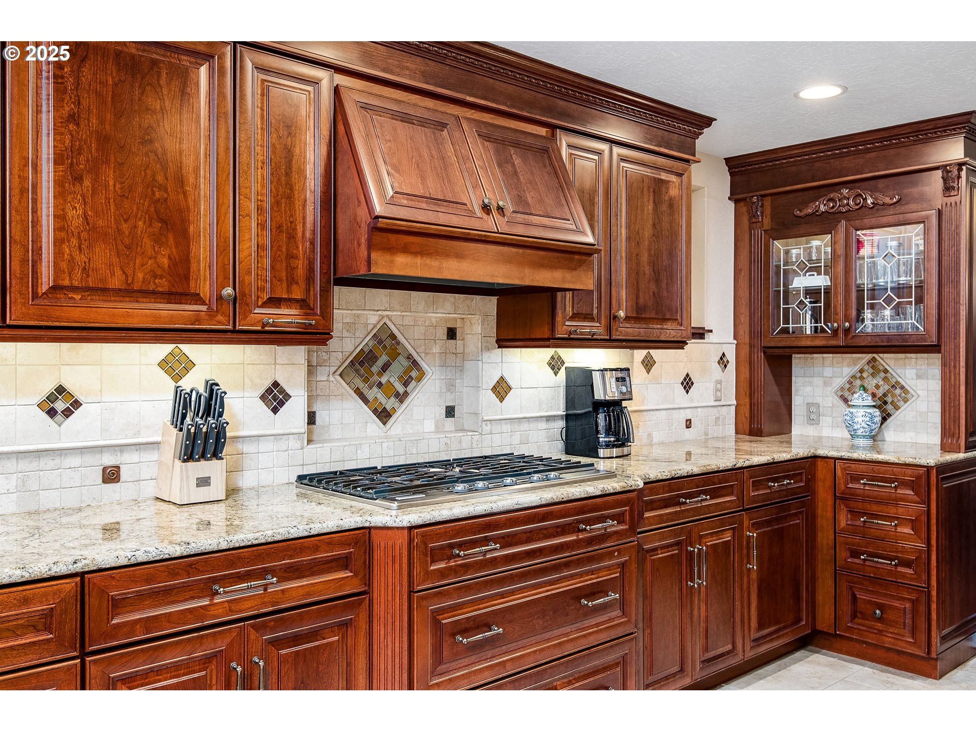 5001 Ford Way Florence, OR 97439 - Photo 9 of 48 a kitchen with granite countertop wooden cabinets and white appliances