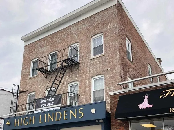 a front view of a building with grey and white walls