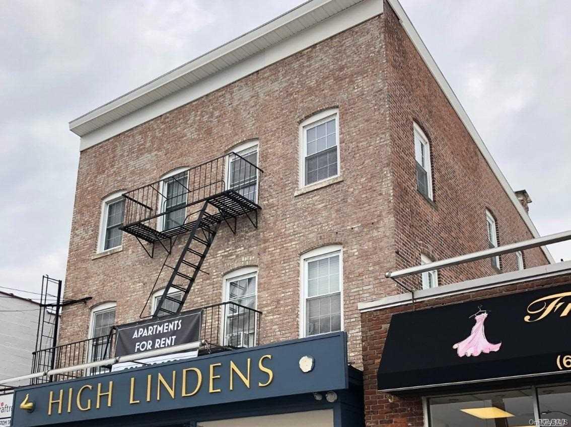7 Green Street, Unit 2F Huntington, NY 11743 - Photo 1 of 8 a front view of a building with grey and white walls