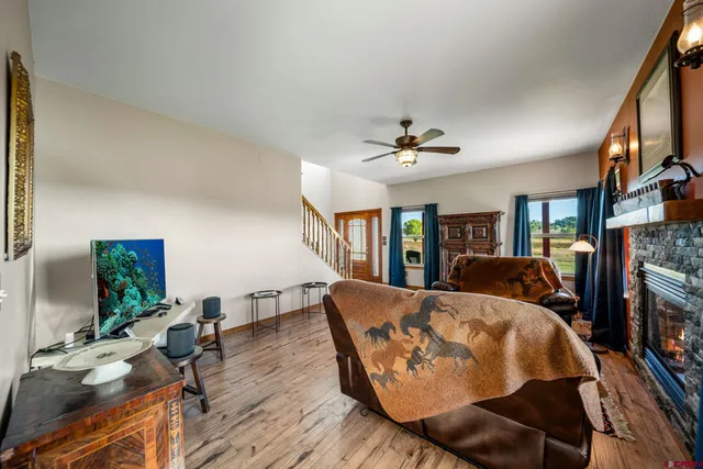 a living room with fireplace furniture and a flat screen tv