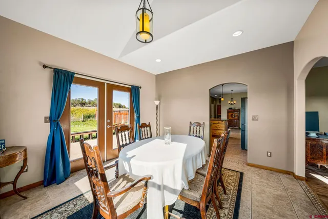 a view of a dining room with furniture and window