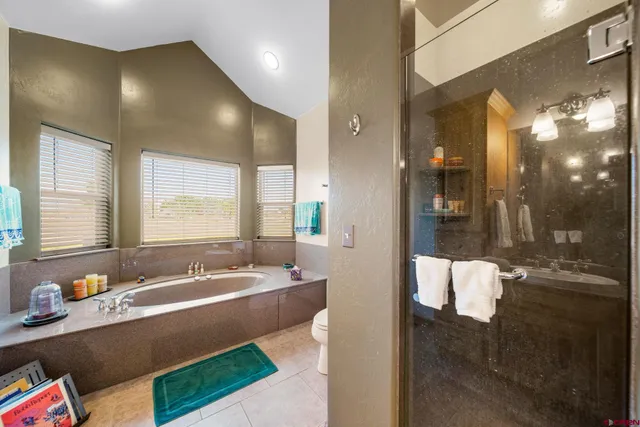 a spacious bathroom with a bathtub and a sink
