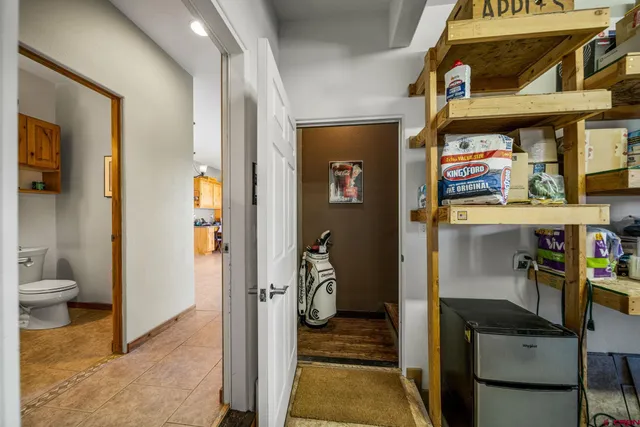 a view of a hallway with the room and front door