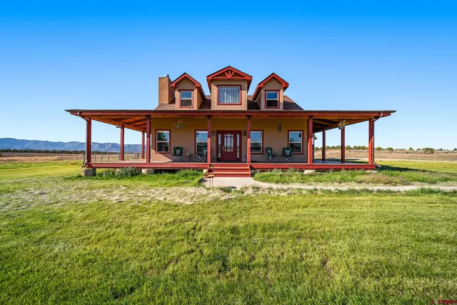 a aerial view of a house with a yard