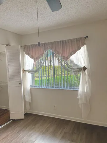 a view of wooden floor in an empty room