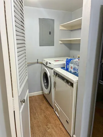 a view of a lake with a house in the background