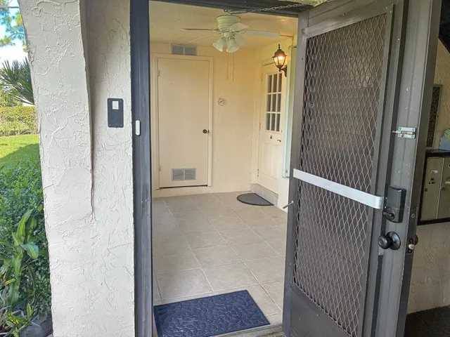 a view of a room that has a large window