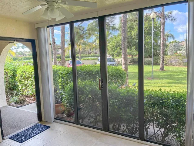 a kitchen with granite countertop white cabinets and stainless steel appliances