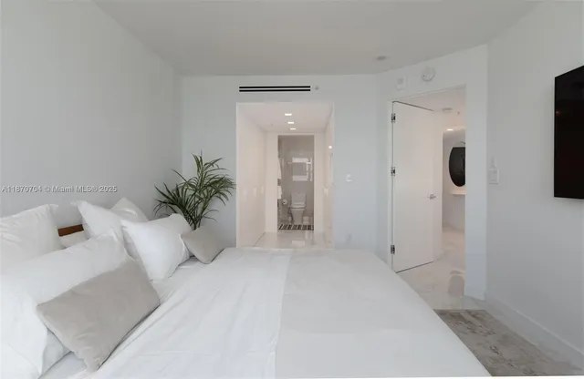 a view of a white bath tub sitting in a bathroom