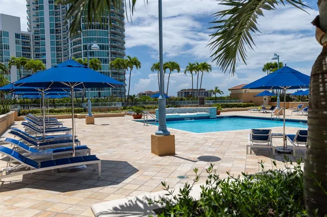 a view of swimming pool with outdoor seating