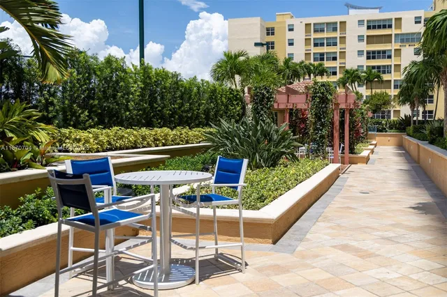 a view of a chairs and table in the terrace