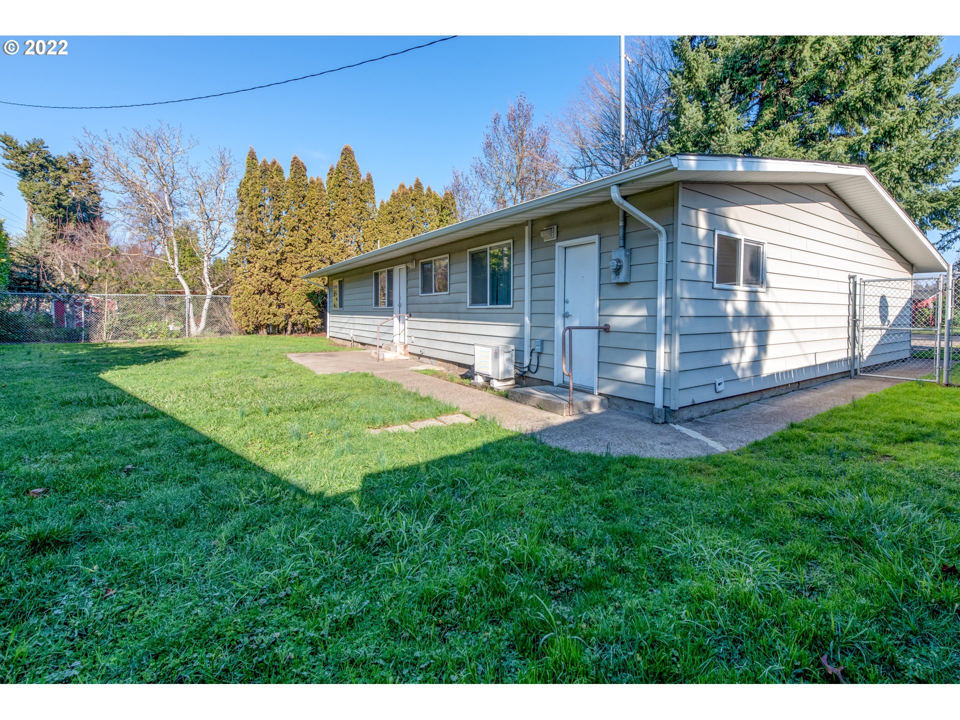 2332 Shadylane Drive Springfield, OR 97477 - Photo 23 of 27 a backyard of a house with wooden deck and barbeque oven
