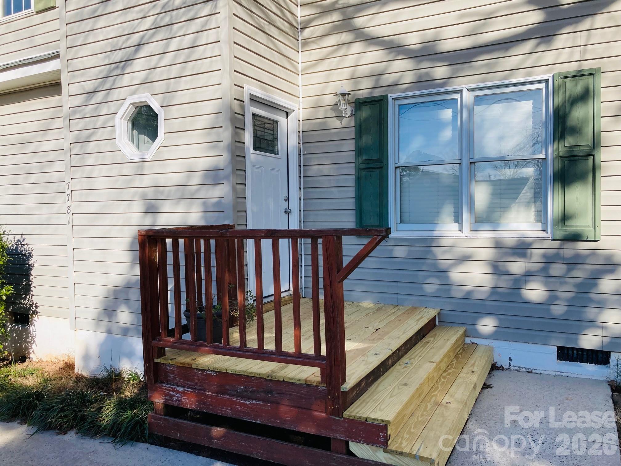 7781 Red Robin Trail Denver, NC 28037 - Photo 2 of 26 a view of a wooden bench in the balcony