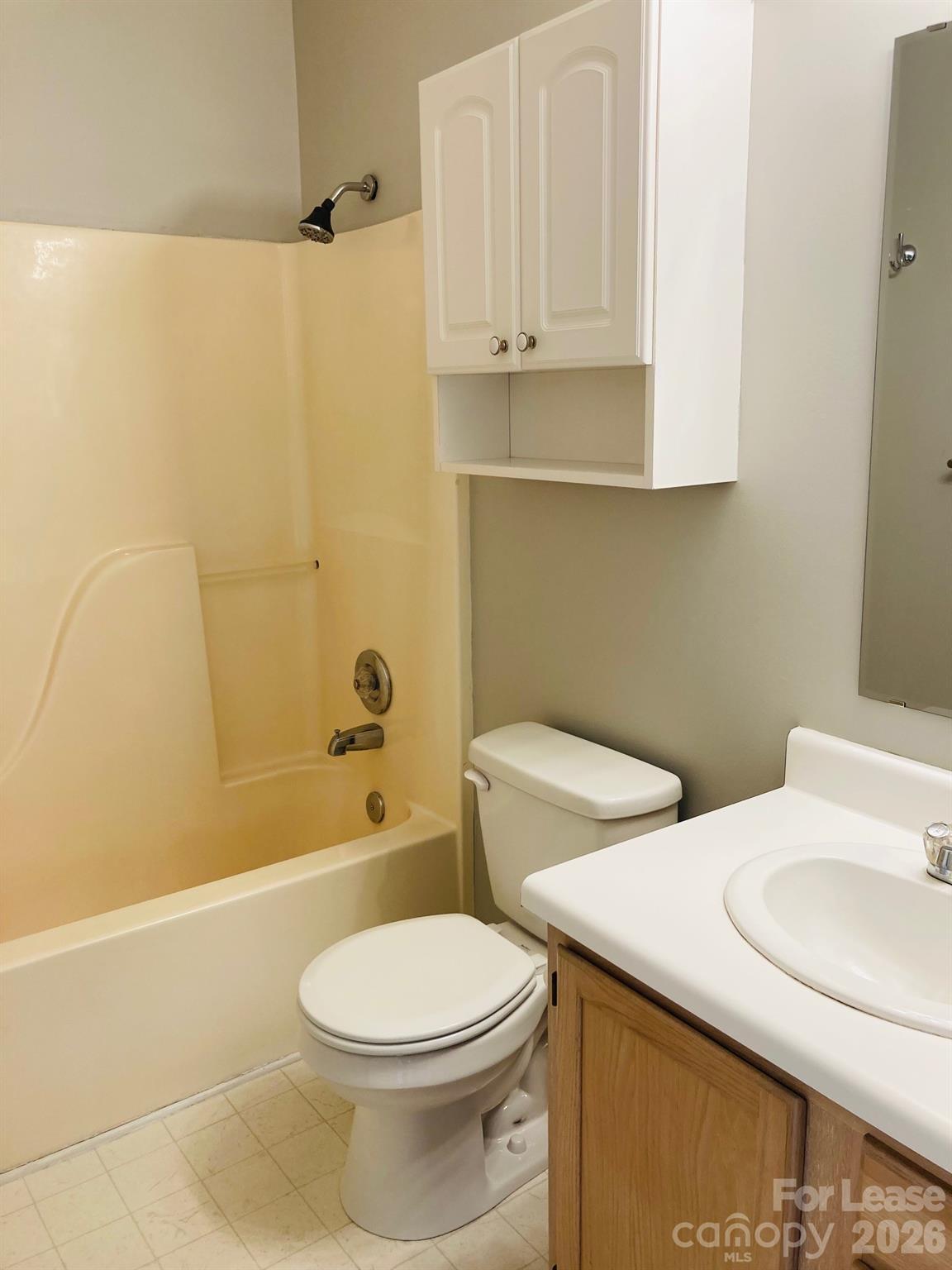 7781 Red Robin Trail Denver, NC 28037 - Photo 21 of 26 a bathroom with a sink a toilet and shower