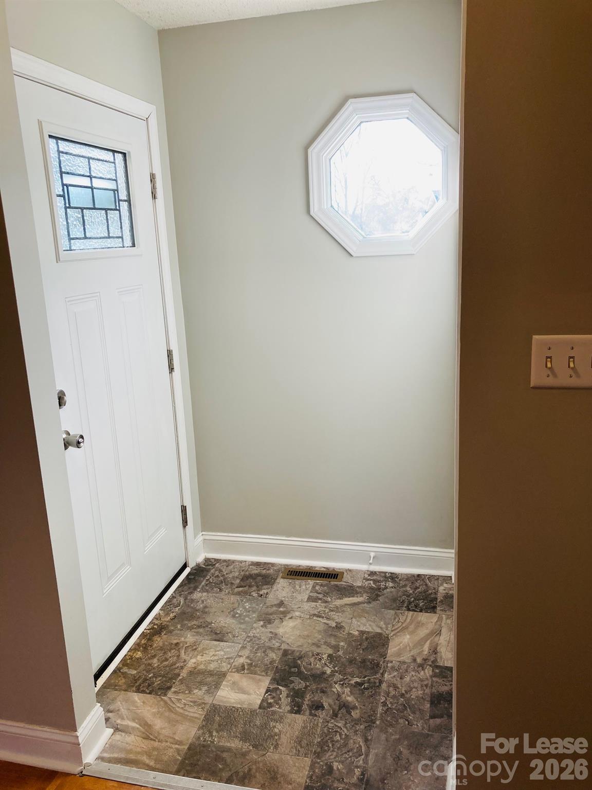 7781 Red Robin Trail Denver, NC 28037 - Photo 7 of 26 an empty room with wooden floor and white walls