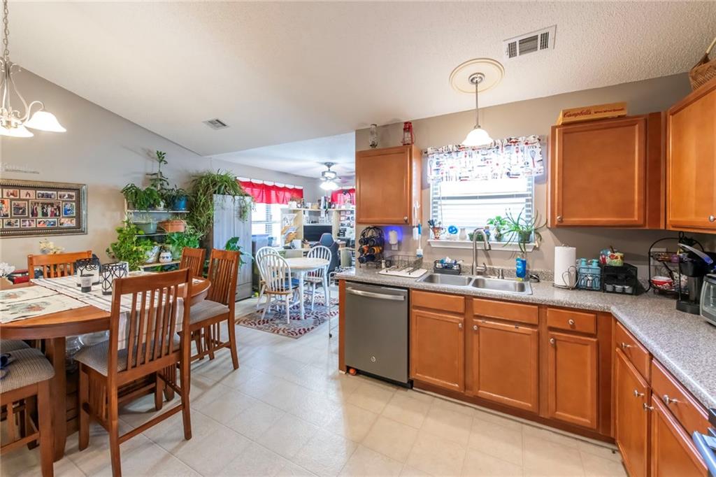 170 Baskin Road Temple, GA 30179 - Photo 13 of 34 a kitchen with stainless steel appliances granite countertop sink window and white cabinets